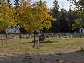 Brownvale Cemetery. There is a large sign near the entrance with the name of the cemetery on it.